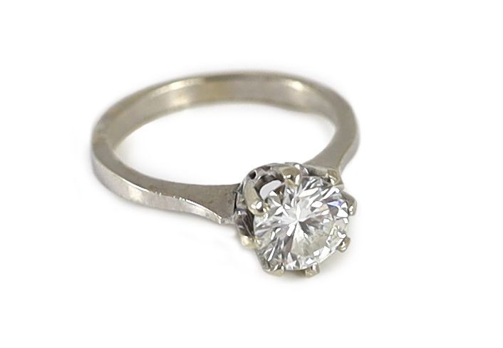 A white gold and solitaire diamond ring